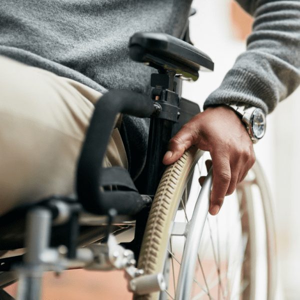 man in basic wheelchair with watch