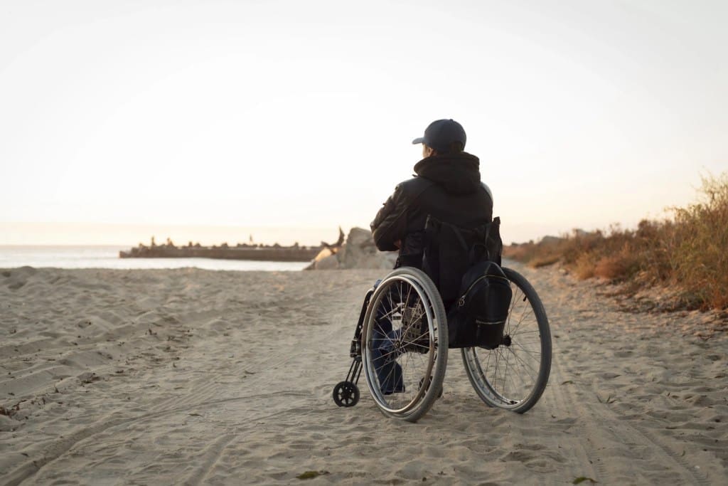 full shot disabled man beach scaled 1